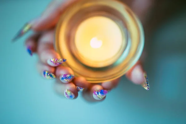 Female Hands Sharp Nails Holding Candlestick Burning Candle — Stock Photo, Image