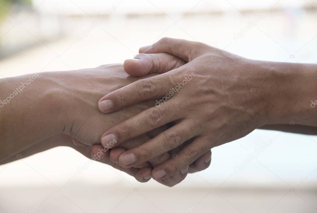 A man giving a hand for sympathy