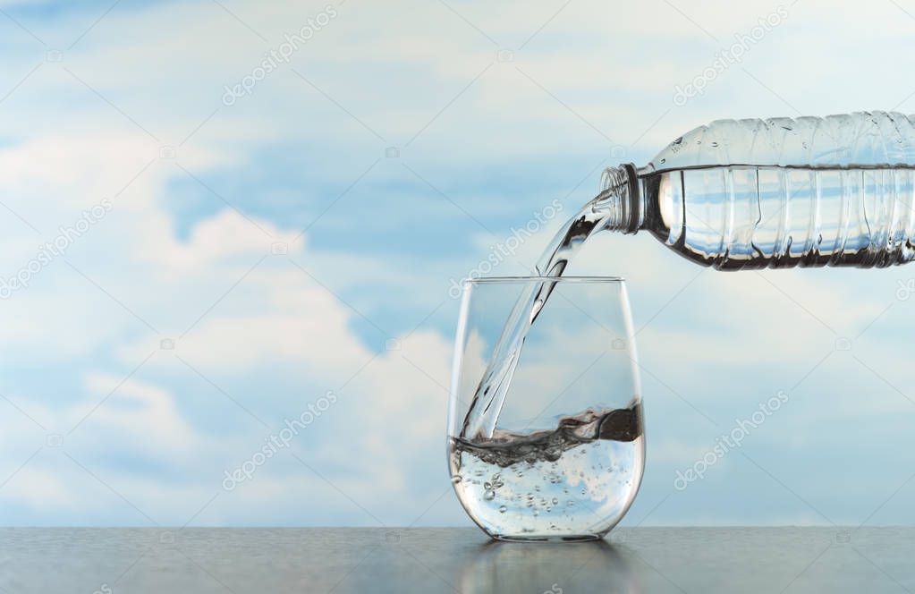 Water splashing in a transparent glass after pouring water