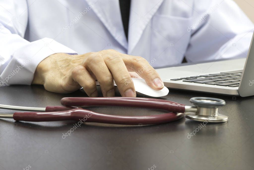 Doctor working with computer
