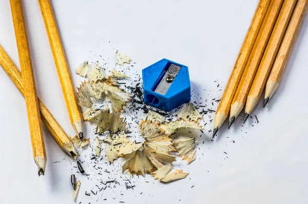 broken and sharpened pencils with sharpener