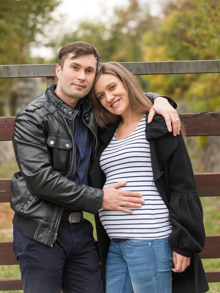 Caucasian couple in autumn expecting — Stock Photo, Image