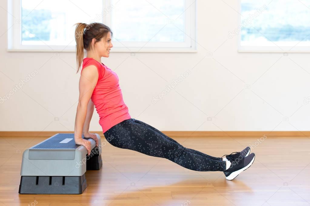 Active young woman exercising 
