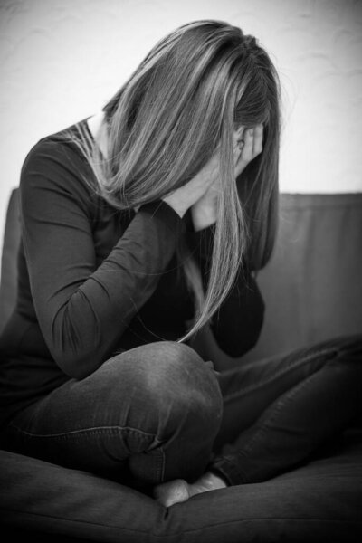 Depressed woman during quarantine due to domestic violence, social distancing or physical problem