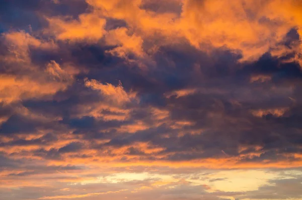Cartoon orange and purple cumulus clouds. Close-up — Stok fotoğraf