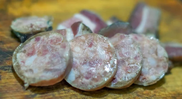 Fatty meat diet sausage and bacon on a tray sliced — Stock Photo, Image