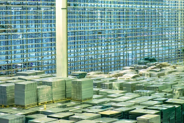 large warehouse storage with drawers, boxes on racks and shelves in several floors store