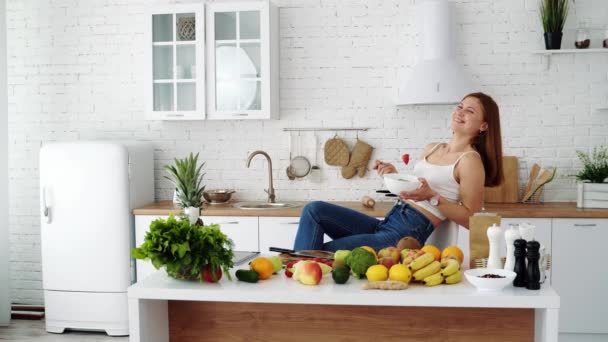 Happy Woman Eats Salad Plate Sitting Chair White Kitchen Table — Stock Video