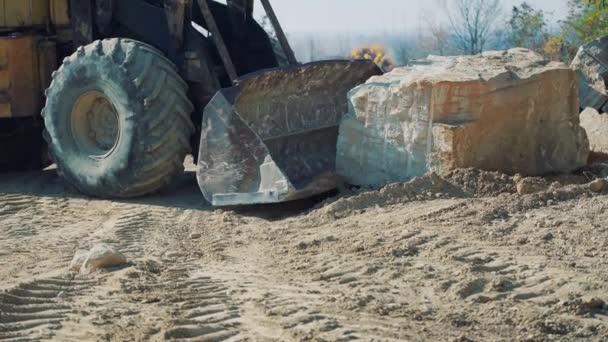 Old Bulldozer Moves Large Stone Quarry Close — Stock Video