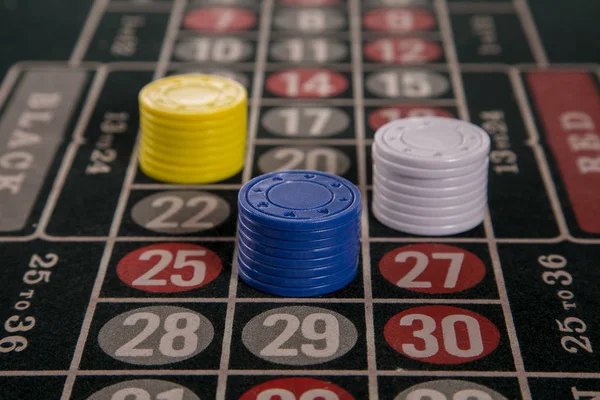 Gambling on a roulette table with different chips — Stock Photo, Image