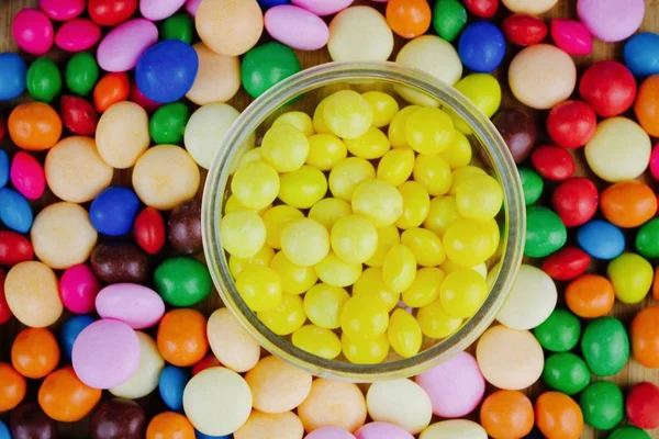 Yellow sweets in the jar — Stock Photo, Image