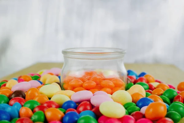 Orange sweets in jar — Stock Photo, Image