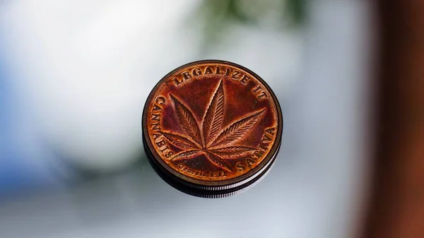 Brass cannabis coin — Stock Photo, Image