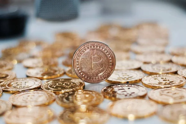 Bitcoin coin on gold coins — Stock Photo, Image