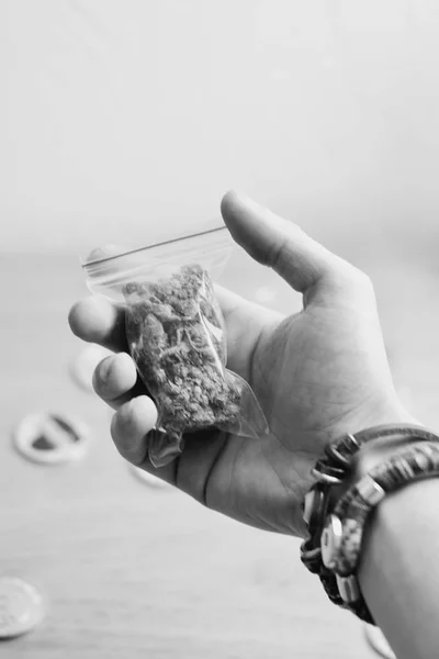 Bag with a marijuana in hand — Stock Photo, Image