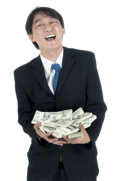 Empresário feliz segurando um monte de dólares americanos em sua mão — Fotografia de Stock