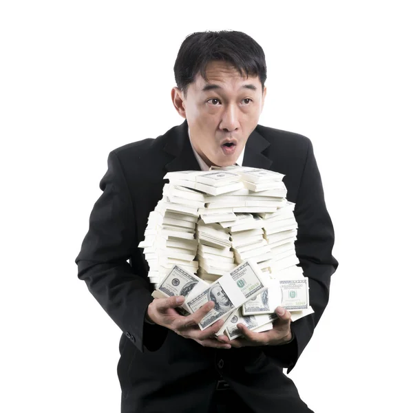 The Businessman holding a big pile of money in his arms on white — Stock Photo, Image