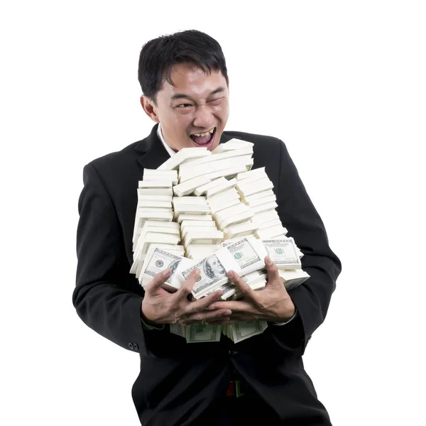 O empresário alegre segurando uma grande pilha de dinheiro em seus braços — Fotografia de Stock