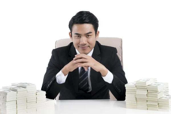 Happy Young businessman clasped hands and large pile of money on — Stock Photo, Image