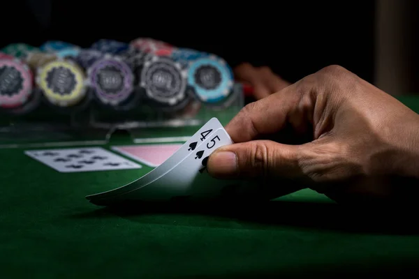 Game of blackjack at a casino with chips on a green blackjack ta — Stock Photo, Image