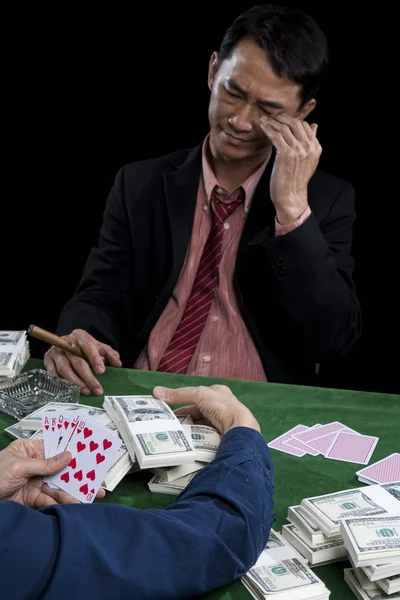 The young gambler is stressed when contender gathered a pile of — Stock Photo, Image