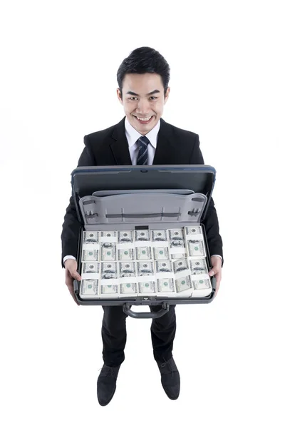 Top view with the young businessman holding full dollars in brie — Stock Photo, Image