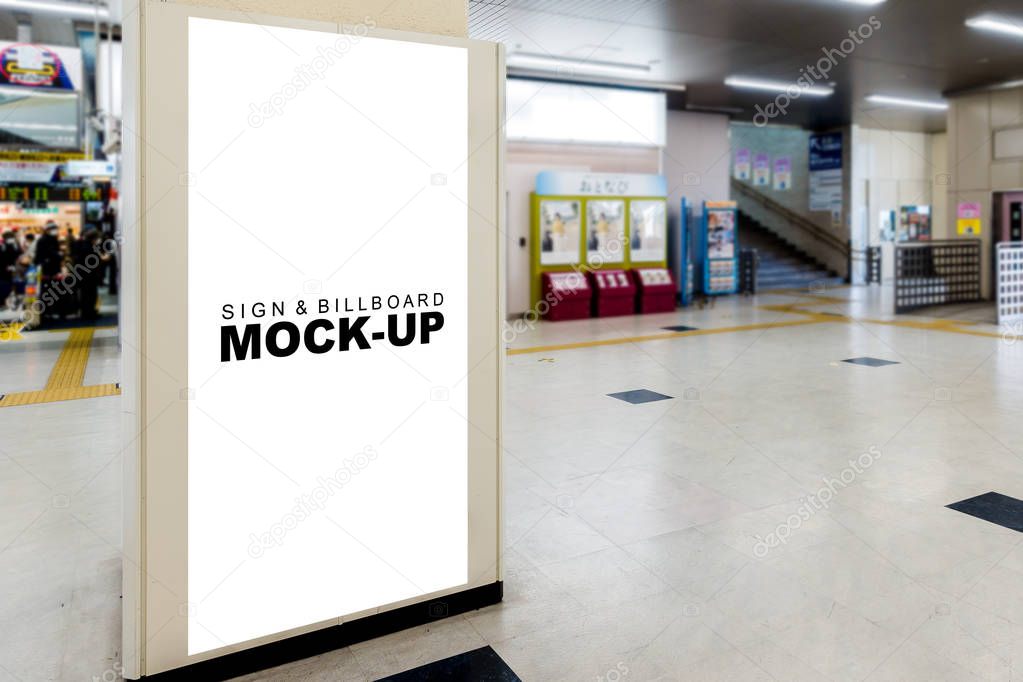 The mock up tall signboard at express train station area, blank white screen on wall or large pole building for advertisement or poster information near the entrance to buy tickets with clipping path
