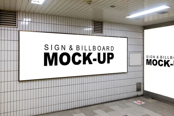 The mock up the advertising signboard in the corner walls with clipping path, blank white space for indoor advertisement or information billboard, Fluorescent light bulbs open on the ceiling