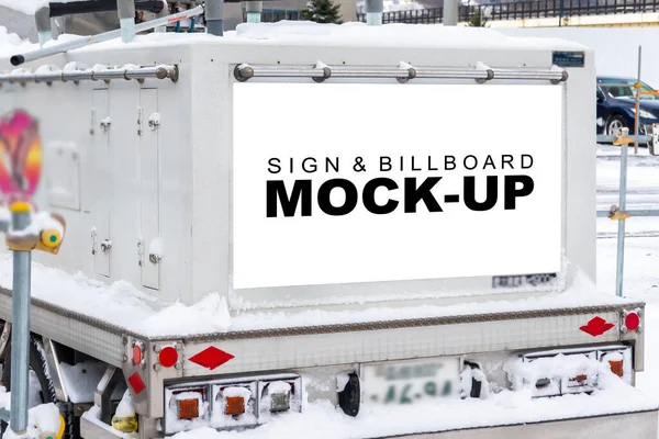 Mock up horizontal billboard with clipping path on the back of the refrigerated trucks, stop on car park with snow in winter, stop on car park with snow in winter