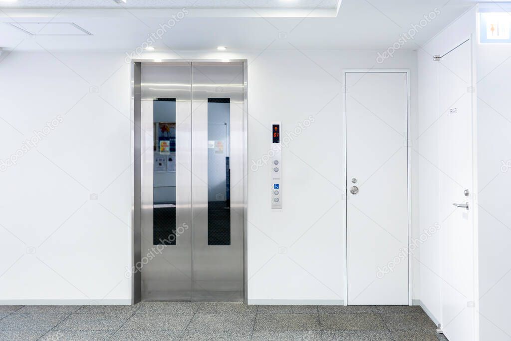 The Elevator in the modern building, closed door stand by near exit door, stand by on first floor, image for background or insert advertising graphic design