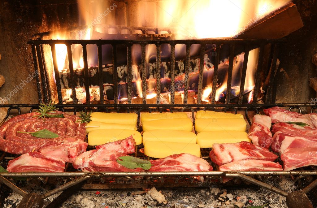 Bovine Raw Meat And Pork Meat Cooking In The Fireplace Stock