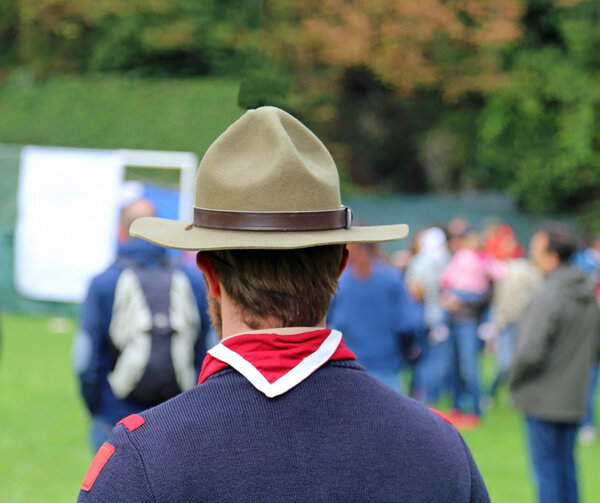 scout leader at international gathering with big hat