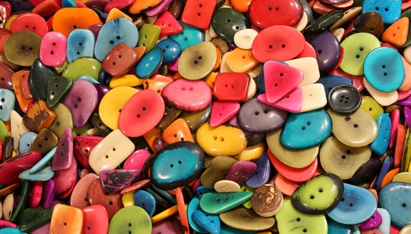 Sfondo di pulsanti colorati realizzati con semi di palma essiccati — Foto Stock