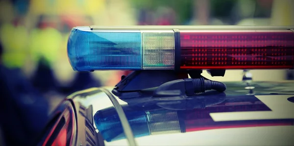 Red and blue flashing lights of the police car at the checkpoint — Stock fotografie