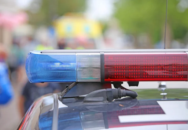 Flashing lights on the police car on patrol — Stock Photo, Image