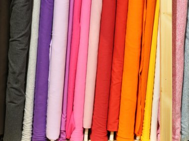 rolls of colorful cloth for sale clipart