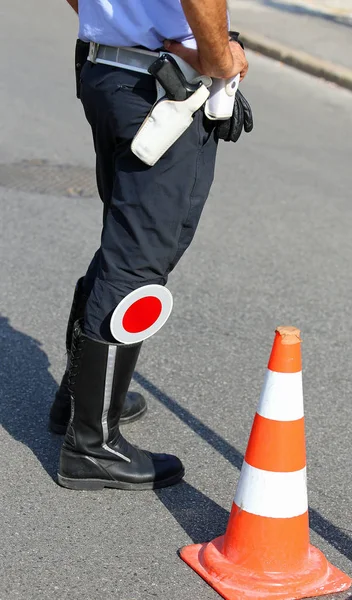 Policeman with red paddle traffic — Stock Photo, Image