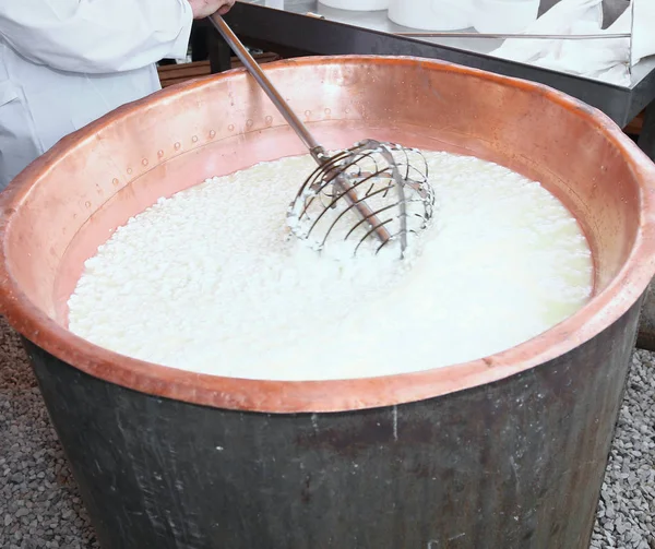 Curdled milk brought to high temperature for the production of c — Stock Photo, Image