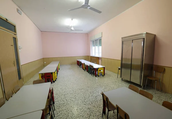 Classroom nursery with benches and colorful plastic chairs — Stock Photo, Image