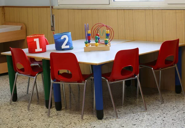 Jars with the written one and two in the school bench in a kinde — Stock Photo, Image