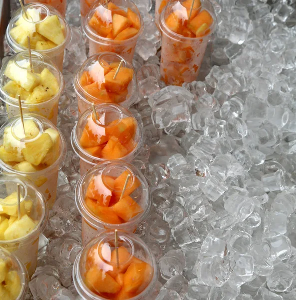 Fruit salad with pineapple and melon in the glasses — Stock Photo, Image