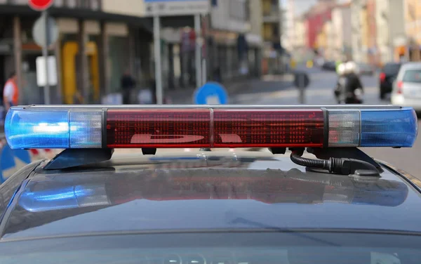 Red and blue flashing lights of the police car  of the metropoli — Stock Photo, Image