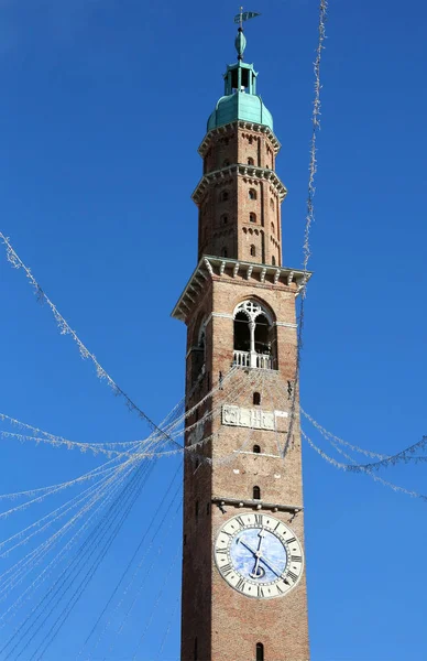 High bell tower of the historic building with christmas lights — Stock Photo, Image