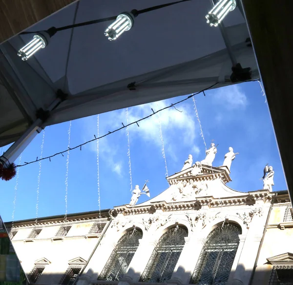 Reflected on a mirror of an ancient church in the square of the — Stock Photo, Image