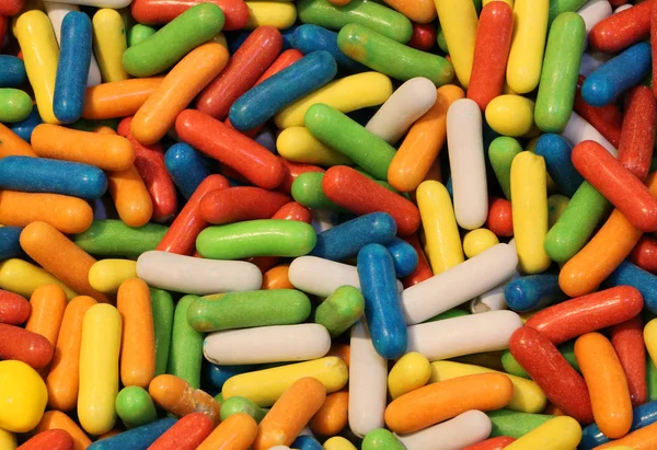 L 색종이 판매 사탕 stor에 착 색 된 설탕으로 덮여 — 스톡 사진