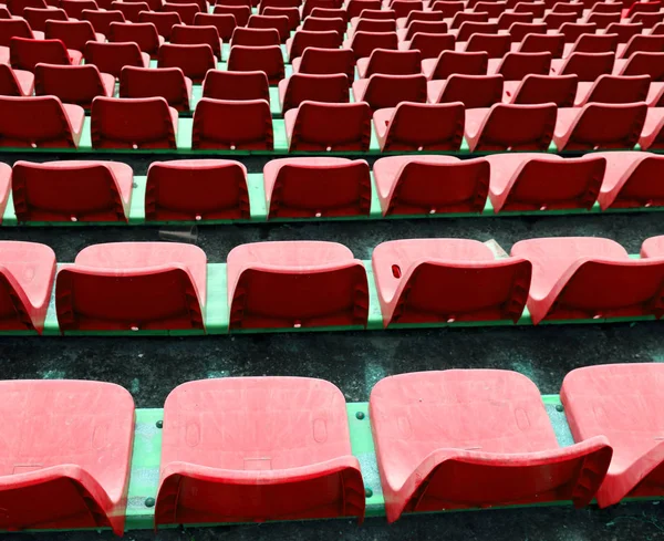 Red empty small chairs on the stadium — Stock Photo, Image