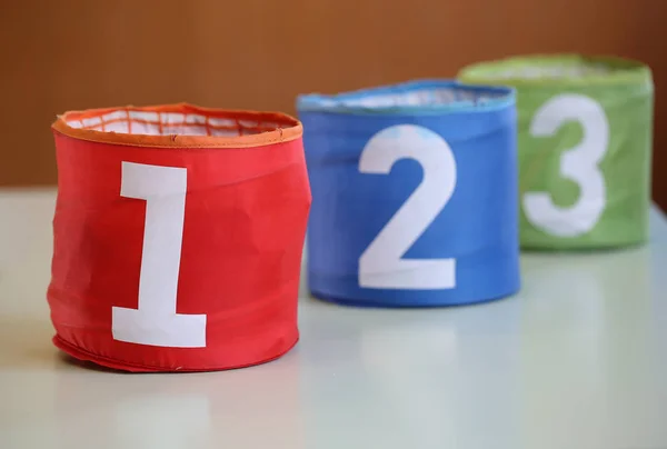 Three jars for toys with numbers one two three and the number on — Stock Photo, Image