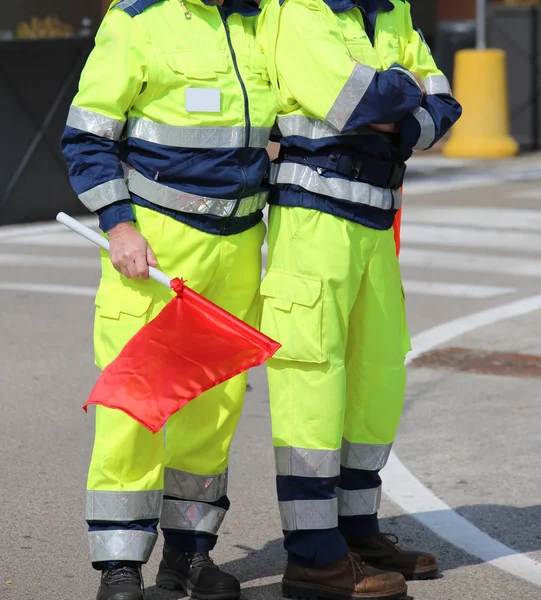 two men of the Italian civil protection with garish uniform and
