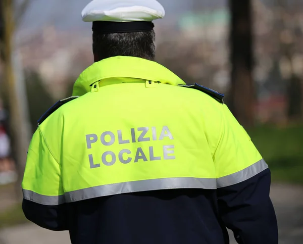 Traffic cop with high visibility uniform and the words local pol — Stock Photo, Image
