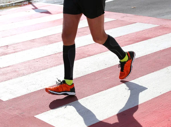 Pedestrian crossing with a runner who runs fast — Stock Photo, Image